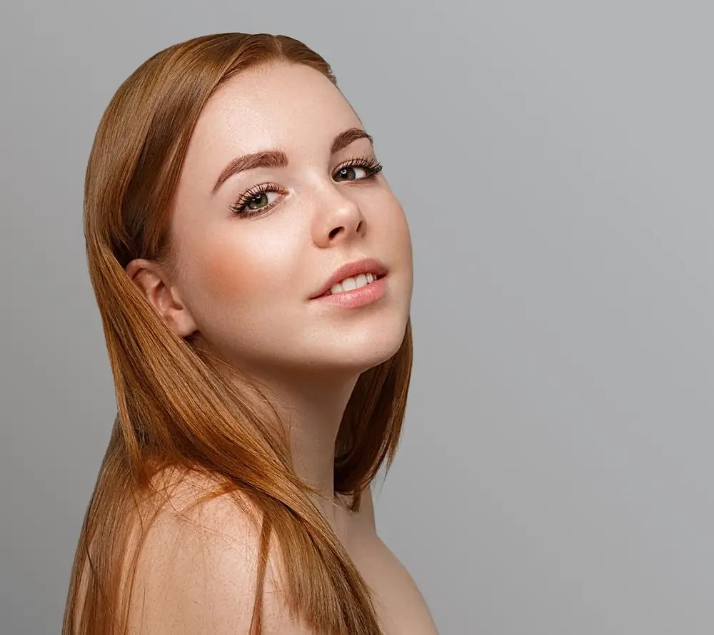 Woman with clear, healthy skin after an acne facial