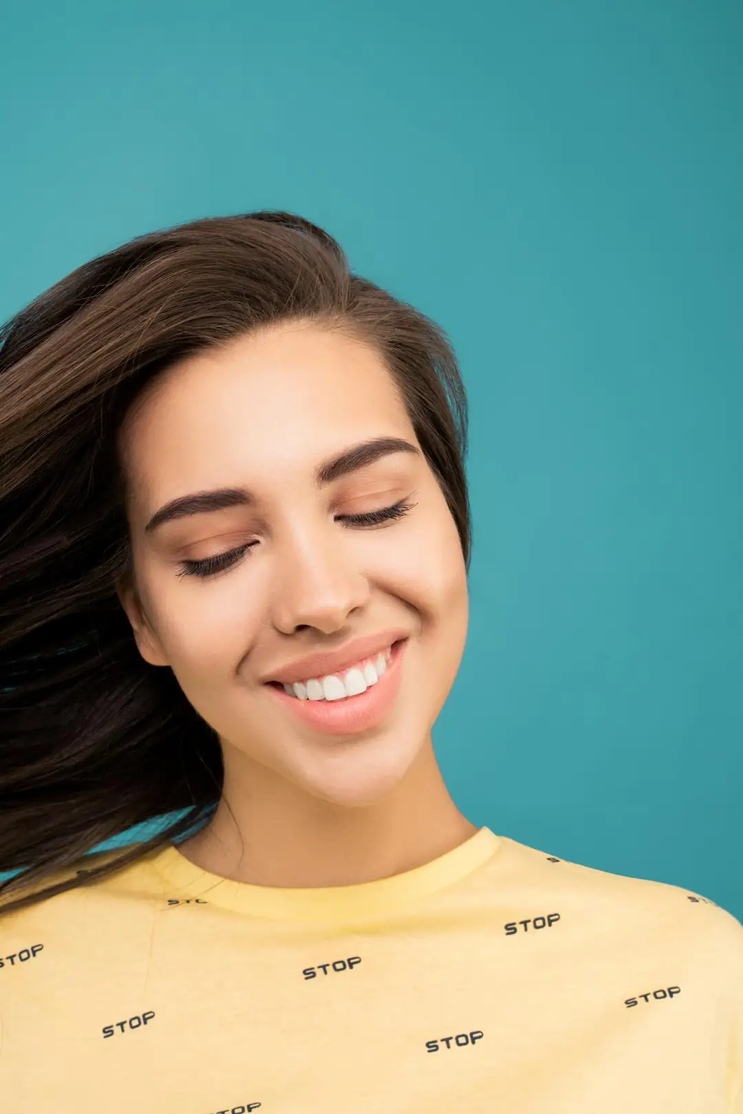 Smiling woman with smooth skin after injectable fillers