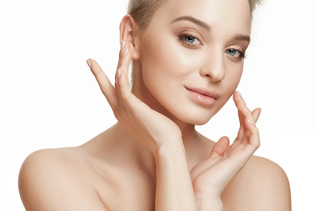 Woman with fresh, glowing skin after a facial